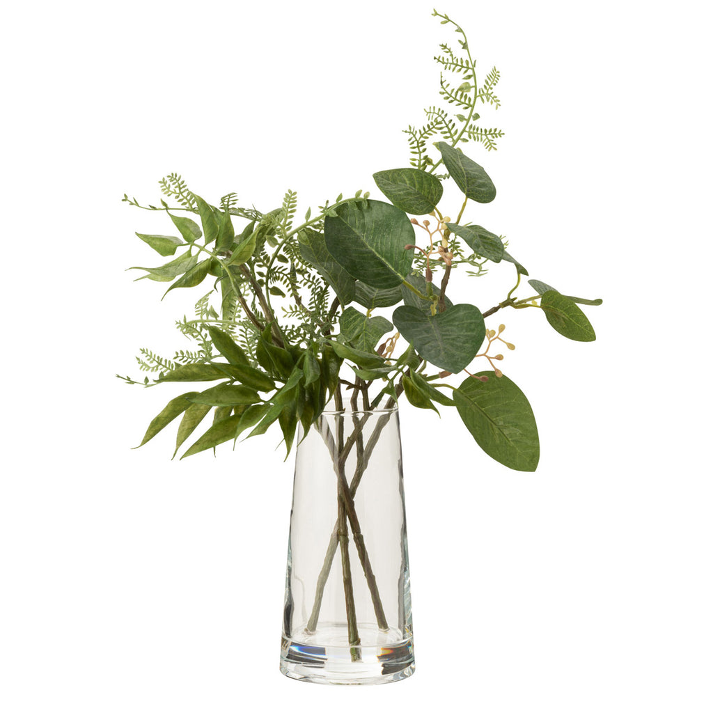 نبتة اصطناعية خضراء مع مزهرية زجاج شفاف